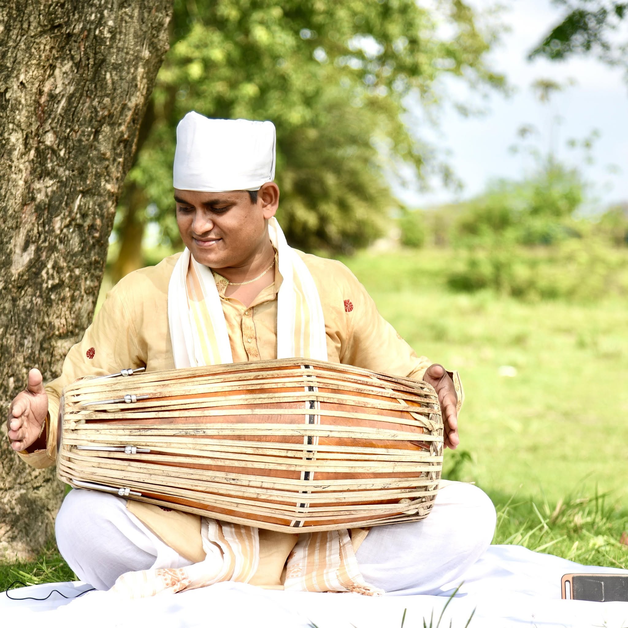 A Khol Vadya performer with the instrument